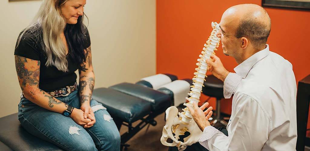 Chiropractor South Austin TX Paul Shrogin Patient Consultation Chiropractor South Austin TX Paul Shrogin Patient Consultation
